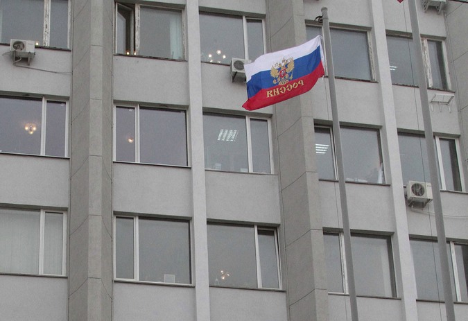 A Russian flag is seen flying outside the State and City administration building in the Crimean city of Sevastopol